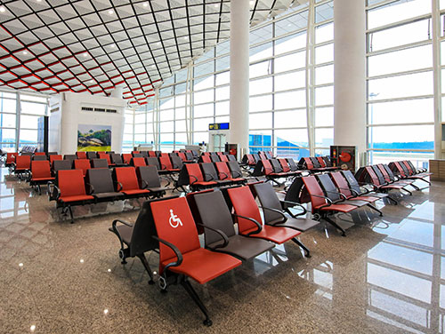 How do airport seats improve passengers' waiting experience?